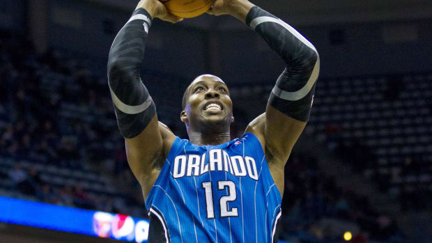 Feb 20, 2012; Milwaukee, WI, USA;  Orlando Magic center Dwight Howard (12) drives for a dunk 