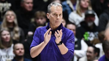 Northwestern Wildcats head coach Chris Collins claps against the Purdue Boilermakers during the second half at Mackey Arena.