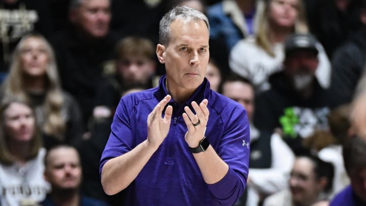 Northwestern Wildcats head coach Chris Collins claps against the Purdue Boilermakers during the second half at Mackey Arena.