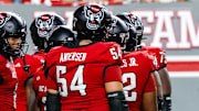 Sep 27, 2025; Raleigh, North Carolina, USA;  North Carolina State Wolfpack huddle during the first half of the game against Virginia Tech Hokies at Carter-Finley Stadium. Mandatory Credit: Jaylynn Nash-Imagn Images