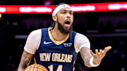 Dec 5, 2024; New Orleans, Louisiana, USA;  New Orleans Pelicans forward Brandon Ingram (14) reacts to a play against Phoenix Suns guard Devin Booker (1) during the first half at Smoothie King Center. Mandatory Credit: Stephen Lew-Imagn Images