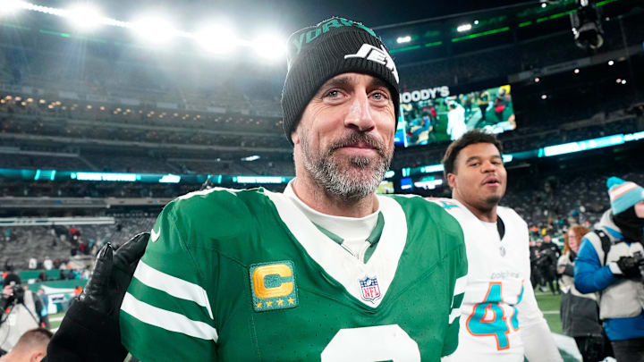 New York Jets quarterback Aaron Rodgers walks off the field following a win. New York Jets quarterback Aaron Rodgers walks off the field following a win.