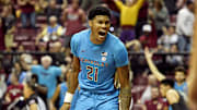 Nov 17, 2021; Tallahassee, Florida, USA; Florida State Seminoles guard Cam'Ron Fletcher (21) reacts after a dunk during the second half against the Tulane Green Wave at Donald L. Tucker Center. Mandatory Credit: Melina Myers-Imagn Images