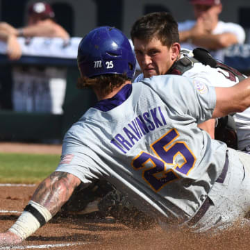 LSU base runner Hayden Travinski is out at home as Texas A&M catcher Max Kaufer holds onto the throw on a safety squeeze play during the SEC Tournament elimination game Friday, May 26, 2023, at the Hoover Met.