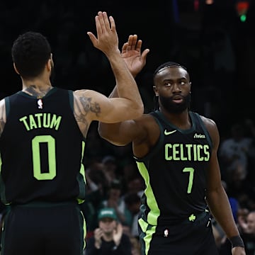 Feb 28, 2025; Boston, Massachusetts, USA; Boston Celtics guard Jaylen Brown (7) high fives forward Jayson Tatum (0) after the Cleveland Cavaliers called a timeout during the first quarter at TD Garden. Mandatory Credit: Winslow Townson-Imagn Images