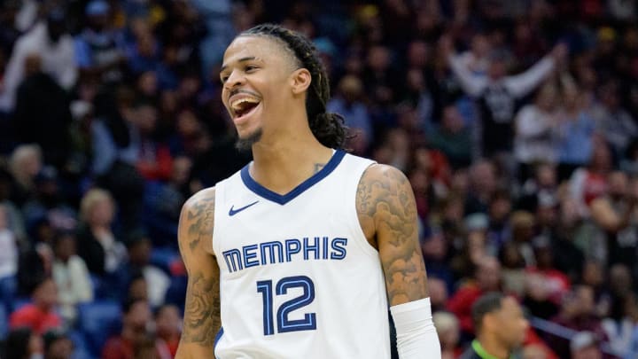 Dec 19, 2023; New Orleans, Louisiana, USA; Memphis Grizzlies guard Ja Morant (12) celebrates a score to even the game during the fourth quarter against the New Orleans Pelicans at the Smoothie King Center. 