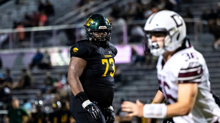 Cedar Rapids Kennedy's Nick Brooks (73) get set before a play during a Class 5A high school football game against Dowling Catholic, Saturday, Aug. 26, 2023, at Kingston Stadium in Cedar Rapids, Iowa.