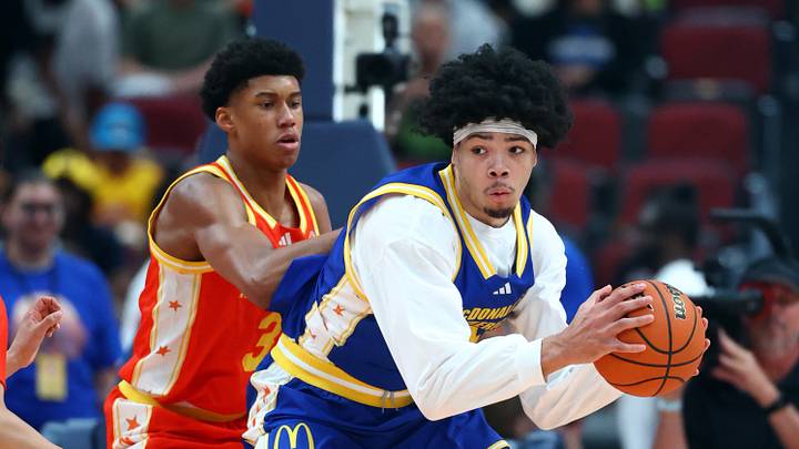 Mar 31, 2026; Glendale, AZ, USA; Tyran Stokes (4) controls the ball against Bruce Branch III (3) during the McDonalds All American Boys Game at Desert Diamond Arena. Mandatory Credit: Mark J. Rebilas-Imagn Images
