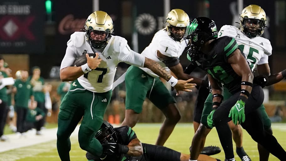 Byrum Brown carries the ball for USF against North Texas.