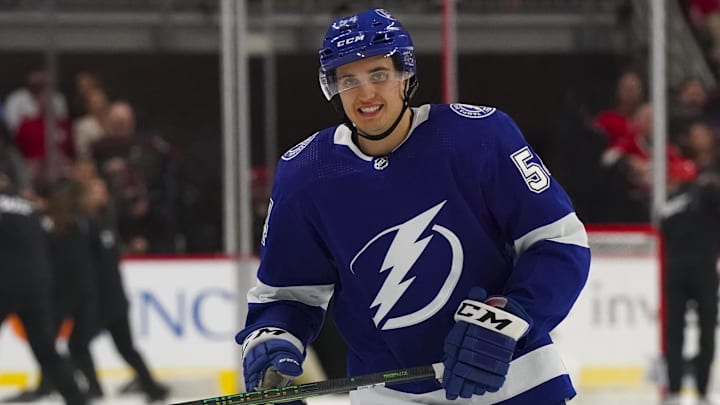 Sep 27, 2022; Raleigh, North Carolina, USA;  Tampa Bay Lightning right wing  Lucas Edmonds (54) skates against the Carolina Hurricanes during the second period at PNC Arena. Mandatory Credit: James Guillory-Imagn Images