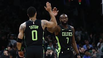 Feb 28, 2025; Boston, Massachusetts, USA; Boston Celtics guard Jaylen Brown (7) high fives forward Jayson Tatum (0) after the Cleveland Cavaliers called a timeout during the first quarter at TD Garden. Mandatory Credit: Winslow Townson-Imagn Images