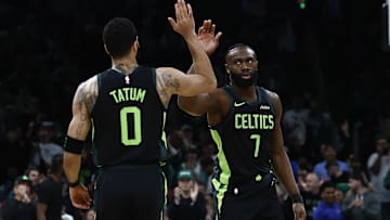 Feb 28, 2025; Boston, Massachusetts, USA; Boston Celtics guard Jaylen Brown (7) high fives forward Jayson Tatum (0) after the Cleveland Cavaliers called a timeout during the first quarter at TD Garden. Mandatory Credit: Winslow Townson-Imagn Images