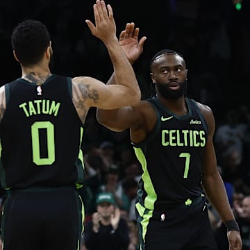 Feb 28, 2025; Boston, Massachusetts, USA; Boston Celtics guard Jaylen Brown (7) high fives forward Jayson Tatum (0) after the Cleveland Cavaliers called a timeout during the first quarter at TD Garden. Mandatory Credit: Winslow Townson-Imagn Images