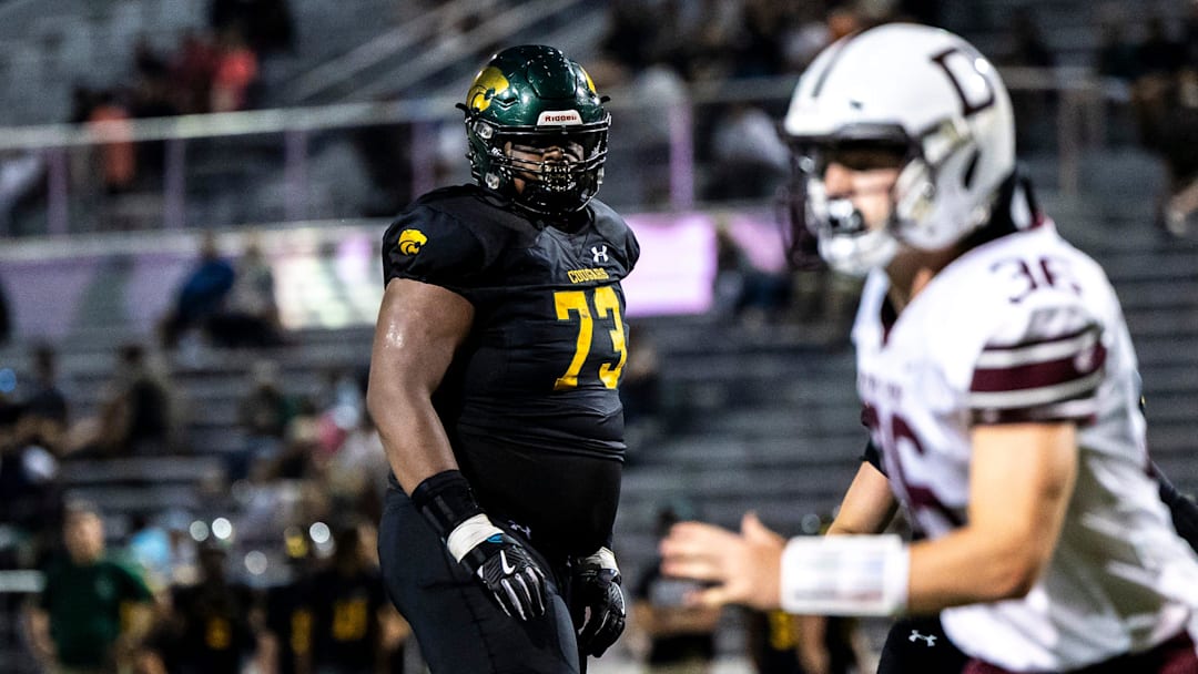 Cedar Rapids Kennedy's Nick Brooks (73) get set before a play during a Class 5A high school football game against Dowling Catholic, Saturday, Aug. 26, 2023, at Kingston Stadium in Cedar Rapids, Iowa.