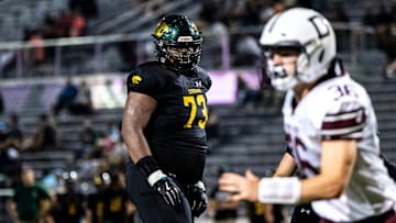 Cedar Rapids Kennedy's Nick Brooks (73) get set before a play during a Class 5A high school football game against Dowling Catholic, Saturday, Aug. 26, 2023, at Kingston Stadium in Cedar Rapids, Iowa.