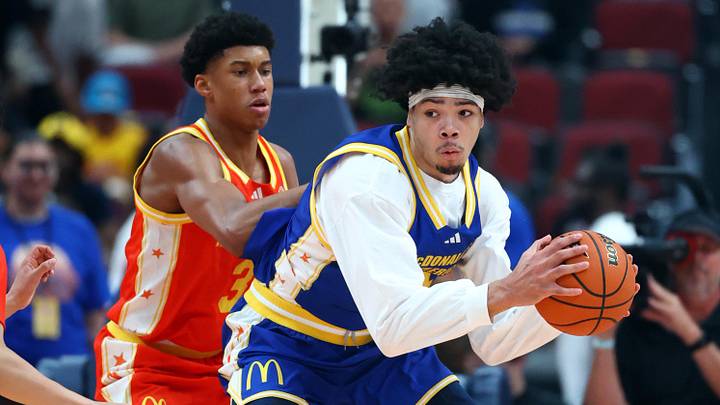 Mar 31, 2026; Glendale, AZ, USA; Tyran Stokes (4) controls the ball against Bruce Branch III (3) during the McDonalds All American Boys Game at Desert Diamond Arena. Mandatory Credit: Mark J. Rebilas-Imagn Images