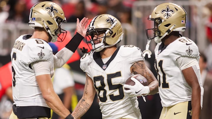 Jan 4, 2026; Atlanta, Georgia, USA; New Orleans Saints wide receiver Ronnie Bell (85) celebrates with quarterback Tyler Shough (6) and wide receiver Kevin Austin Jr. (81) after a touchdown against the Atlanta Falcons in the fourth quarter at Mercedes-Benz Stadium. Mandatory Credit: Brett Davis-Imagn Images