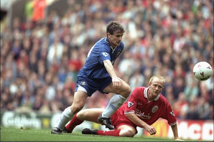Mark Hughes of Chelsea (left) leaves an upended Mark Wright of Liverpool