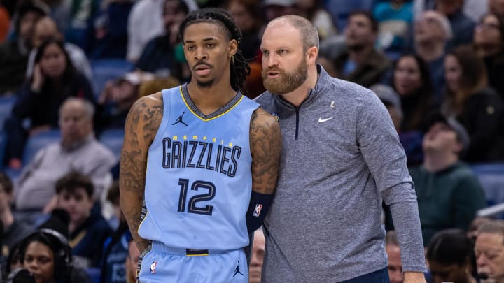 Dec 26, 2023; New Orleans, Louisiana, USA; Memphis Grizzlies head coach Taylor Jenkins talks with guard Ja Morant (12) in the second half against the New Orleans Pelicans at the Smoothie King Center. Mandatory Credit: Stephen Lew-USA TODAY Sports