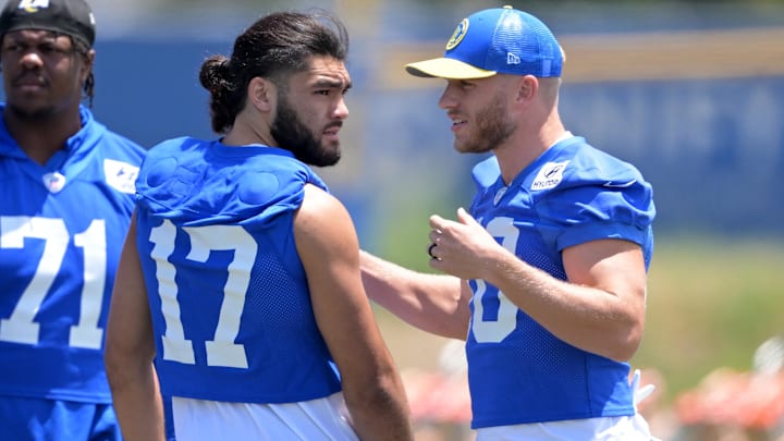 May 28, 2024; Thousand Oaks, CA, USA; Los Angeles Rams wide receiver Puka Nacua (17) and wide receiver Cooper Kupp (10) talk during OTAs at California Lutheran University. Mandatory Credit: Jayne Kamin-Oncea-Imagn Images