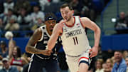 Jan 21, 2025; Storrs, Connecticut, USA; UConn Huskies forward Alex Karaban (11) reacts after his three point basket against Butler Bulldogs forward Jahmyl Telfort (11) in the first half at Harry A. Gampel Pavilion. Mandatory Credit: David Butler II-Imagn Images