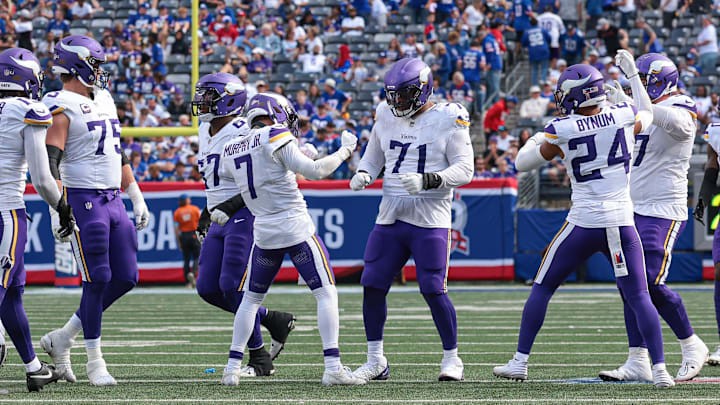 Sep 8, 2024; East Rutherford, New Jersey, USA; Minnesota Vikings cornerback Byron Murphy Jr. (7) celebrates with teammates after defensive stop during the second half against the New York Giants at MetLife Stadium. Mandatory Credit: Vincent Carchietta-Imagn Images