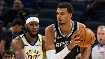Oct 13, 2025; Indianapolis, Indiana, USA; San Antonio Spurs forward/center Victor Wembanyama (1) holds the ball while Indiana Pacers forward Isaiah Jackson (22) defends in the first half at Gainbridge Fieldhouse.