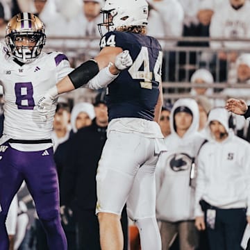 Cameron Broussard gets hemmed in by a pair of Penn State players.