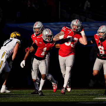Ohio State Buckeyes defensive end Jack Sawyer (33) reacts to intercepting a pass during the second half of the NCAA football game against the Michigan Wolverines at Ohio Stadium in Columbus on Saturday, Nov. 30, 2024. Michigan won 13-10.
