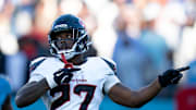 Houston running back Woody Marks (27) signals a first down to allow the Texans to run out the clock and kick a game-winning field goal to beat the Tennessee Titans 16-13 during their game at Nissan Stadium in Nashville, Tenn., Sunday, Nov. 16, 2025