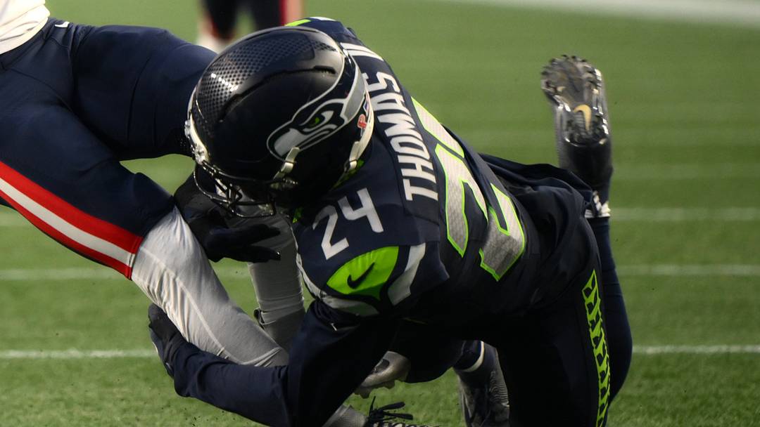 Sep 9, 2026; Seattle, Washington, USA;  Seattle Seahawks safety Rodney Thomas II (24) tackles New England Patriots wide receiver Demario Douglas (3) during the third quarter at Lumen Field.  Mandatory Credit: Steven Bisig-Imagn Images