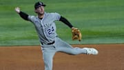 May 13, 2025; Arlington, Texas, USA; Colorado Rockies third baseman Ryan McMahon (24) throws to first base during the fifth inning against the Texas Rangers at Globe Life Field.