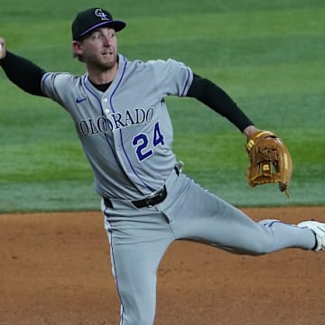 May 13, 2025; Arlington, Texas, USA; Colorado Rockies third baseman Ryan McMahon (24) throws to first base during the fifth inning against the Texas Rangers at Globe Life Field.