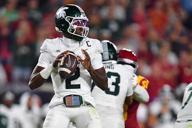 Michigan State Spartans quarterback Aidan Chiles (2) drops back to pass against the Southern California Trojans