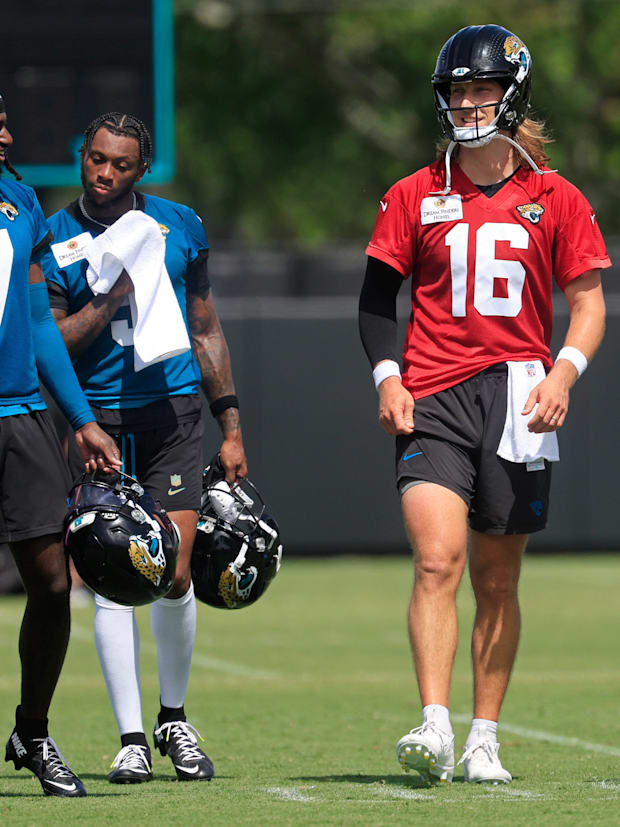 Jacksonville Jaguars wide receiver Dyami Brown (5) and quarterback Trevor Lawrence (16).