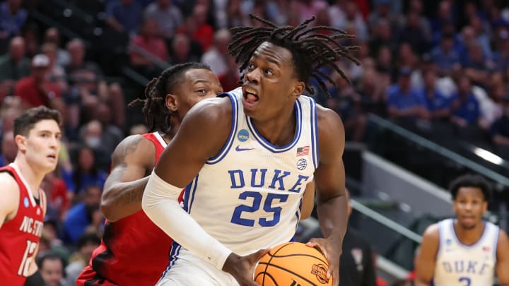 Mar 31, 2024; Dallas, TX, USA; Duke Blue Devils forward Mark Mitchell (25) controls the ball against North Carolina State Wolfpack guard DJ Horne (0) in the first half in the finals of the South Regional of the 2024 NCAA Tournament at American Airline Center. Mandatory Credit: Kevin Jairaj-USA TODAY Sports