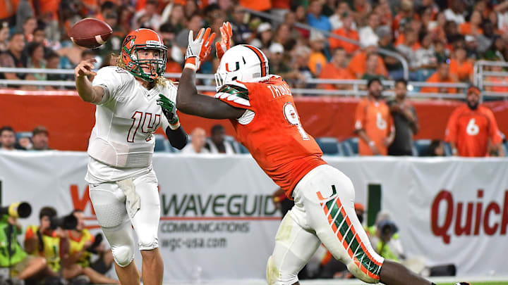 Sep 3, 2016; Miami Gardens, FL, USA;  Miami Hurricanes defensive lineman Chad Thomas (9) pressured Florida A&M Rattlers quarterback Ryan Stanley (14) during the second half at Hard Rock Stadium. The Miami Hurricanes defeat the Florida A&M Rattlers 70-3. Mandatory Credit: Jasen Vinlove-Imagn Images