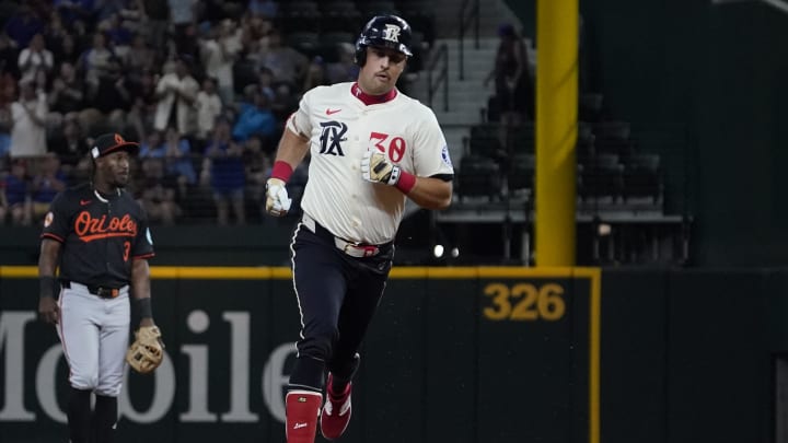 Jul 19, 2024; Arlington, Texas, USA; Texas Rangers first baseman Nathaniel Lowe (30) runs the bases after hitting a solo home run during the second inning against the Baltimore Orioles at Globe Life Field. Mandatory Credit: Raymond Carlin III-USA TODAY Sports