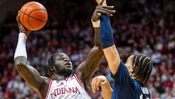 Indiana's Oumar Ballo (11) shoots past Penn State's Yanic Konan Niederhauser (14) on Wednesday in Bloomington, Ind. 