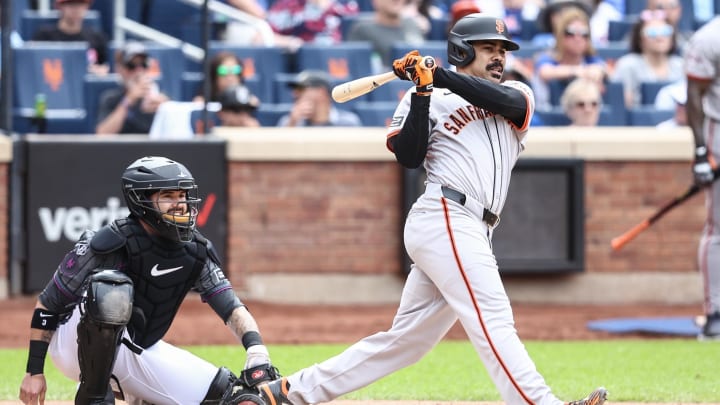 May 25, 2024; New York City, New York, USA;  San Francisco Giants pinch hitter LaMonte Wade Jr. (31) hits an RBI single in the ninth inning to tie the game against the New York Mets at Citi Field.