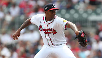 Jun 29, 2025; Cumberland, Georgia, Atlanta Braves relief pitcher Raisel Iglesias (26) pitches during a game against the Philadelphia Phillies during the ninth inning at Truist Park. Mandatory Credit: Mady Mertens-Imagn Images