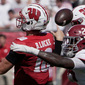 Alabama defensive lineman LT Overton (22) forces an incomplete pass by Wisconsin quarterback Braedyn Locke (18) during the third quarter of their game Saturday, September 14, 2024 at Camp Randall Stadium in Madison, Wisconsin. Alabama beat Wisconsin 42-10.