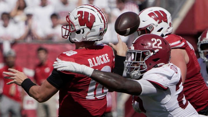 Alabama defensive lineman LT Overton (22) forces an incomplete pass by Wisconsin quarterback Braedyn Locke (18) during the third quarter of their game Saturday, September 14, 2024 at Camp Randall Stadium in Madison, Wisconsin. Alabama beat Wisconsin 42-10.