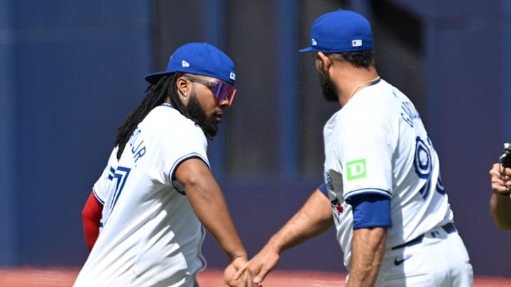 Toronto Blue Jays first baseman Vladimir Guerrero Jr. (27) slaps hands with relief pitcher Yimi Garcia (93) after a win over the Baltimore Orioles at Rogers Centre on June 6.