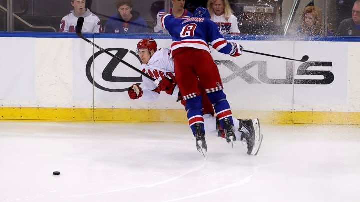 May 7, 2024; New York, New York, USA; New York Rangers defenseman Jacob Trouba (8) checks Carolina Hurricanes center Martin Necas (88) during the first overtime of game two of the second round of the 2024 Stanley Cup Playoffs at Madison Square Garden. Mandatory Credit: Brad Penner-USA TODAY Sports