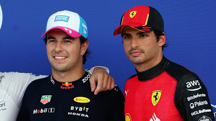 May 6, 2023; Miami Gardens, Florida, USA;  Aston Martin driver Fernando Alonso (14) of Spain , Red Bull driver Sergio Perez (11) of Mexico , Ferrari driver Carlos Sainz (55) of Spain pose after qualifying for the Miami Grand Prix at Miami International Autodrome. Mandatory Credit: John David Mercer-Imagn Images