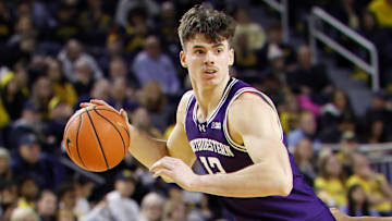 Jan 19, 2025; Ann Arbor, Michigan, USA;  Northwestern Wildcats guard Brooks Barnhizer (13) dribbles in the second half against the Michigan Wolverines at Crisler Center. Mandatory Credit: Rick Osentoski-Imagn Images