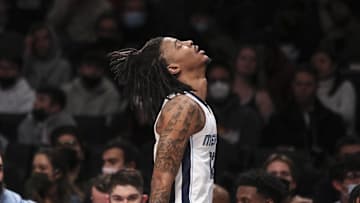 Jan 3, 2022; Brooklyn, New York, USA;  Memphis Grizzlies guard Ja Morant (12) goes to the bench after getting injured in the first quarter against the Brooklyn Nets at Barclays Center. Mandatory Credit: Wendell Cruz-Imagn Images