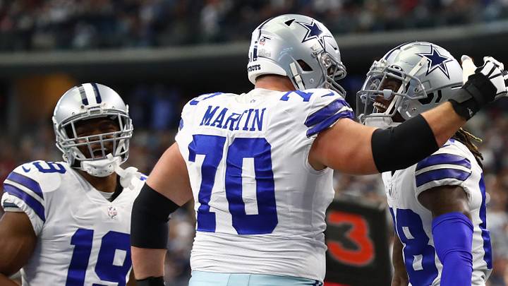 Dallas Cowboys receiver CeeDee Lamb (88) celebrates his first-quarter touchdown with guard Zack Martin (70) against the Atlanta Falcons at AT&T Stadium.