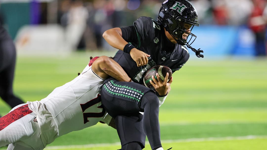 San Diego State's Owen Chambliss, a first-team all-conference linebacker as a sophomore under defensive coordinator Rob Aurich, sacks Hawaii quarterback Micah Alejado.